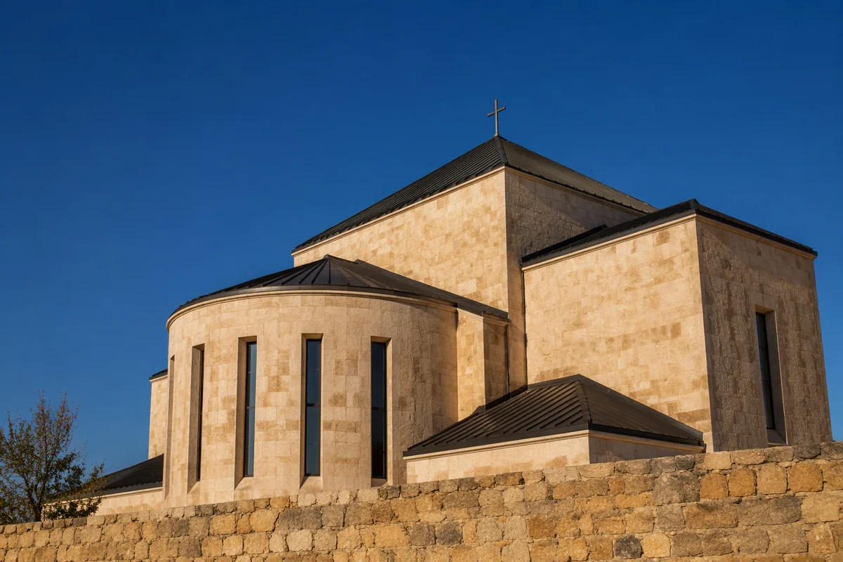 Modern Limestone Church Beneath Clear Blue Sky