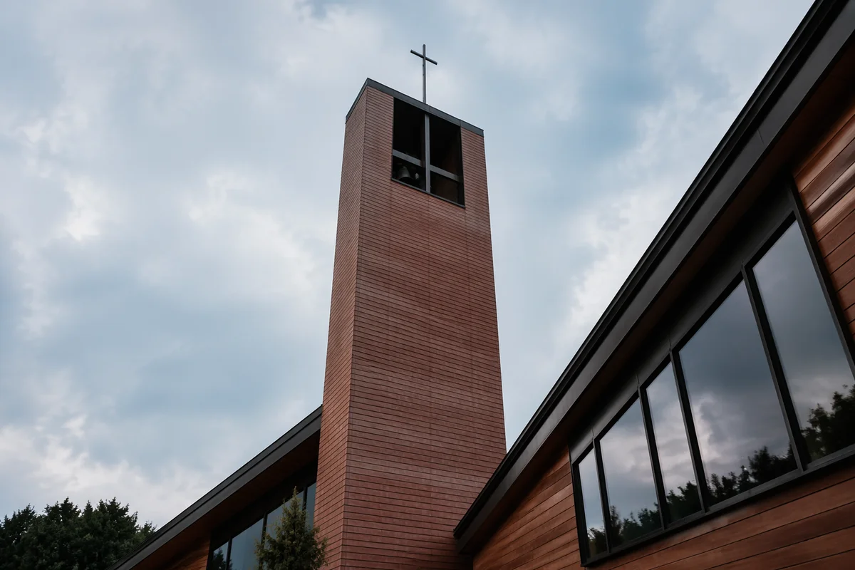 Modern Church Bell Tower Under Cloudy Sky