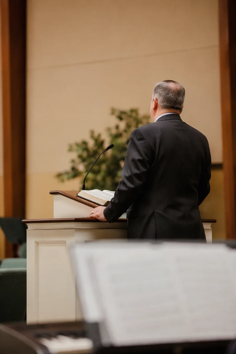 Pastor Preaching at White Church Pulpit