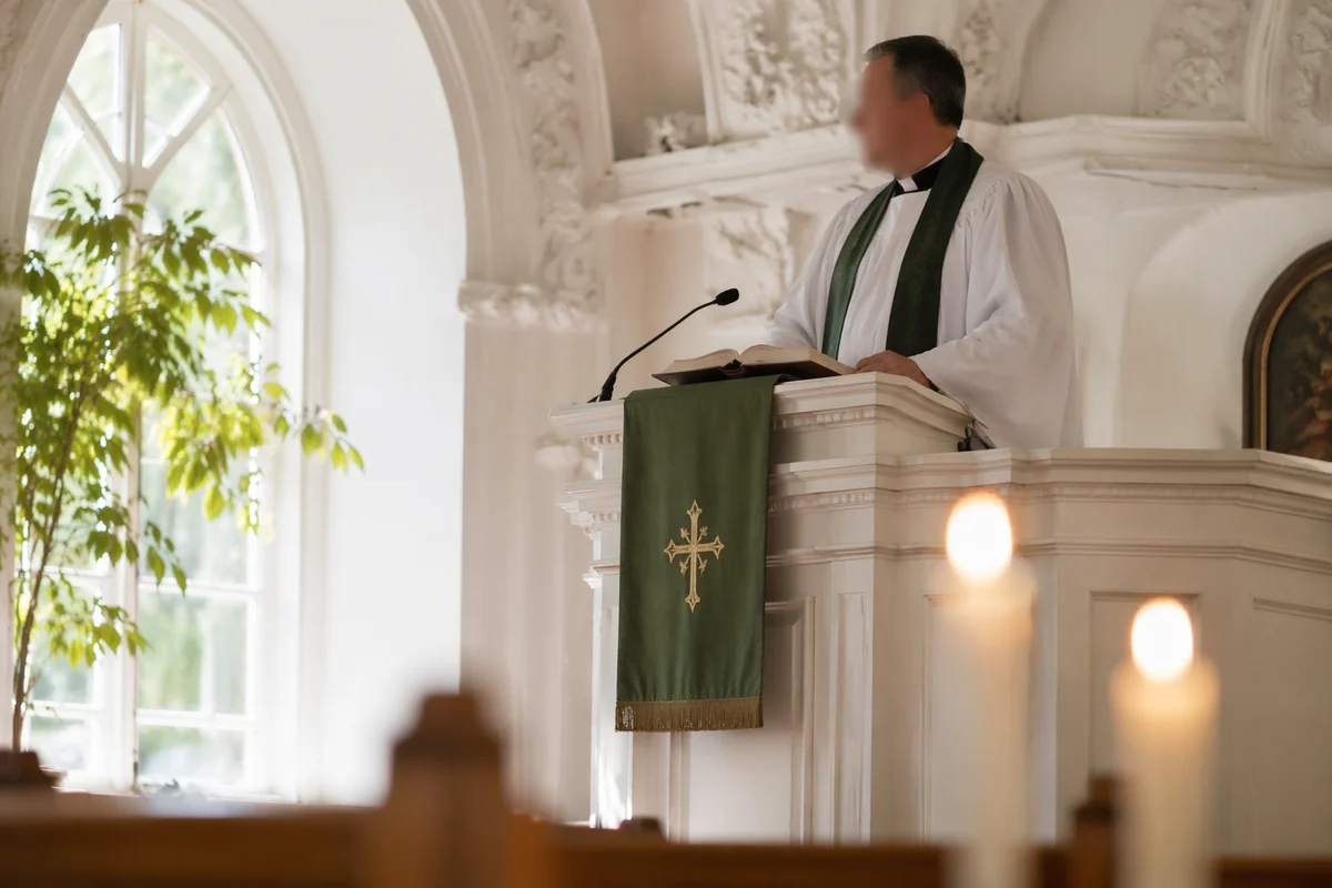 Pastor Preaching at White Church Pulpit