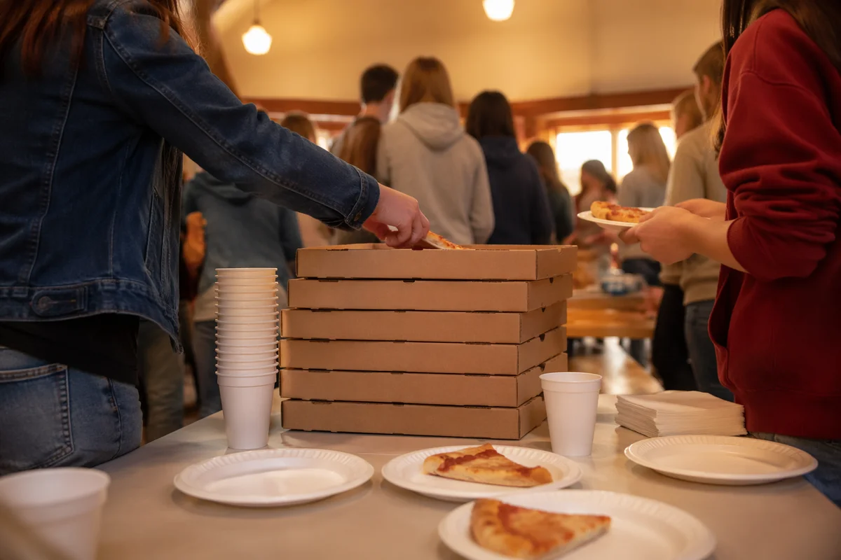 Stacked Pizza Boxes at Youth Group Party