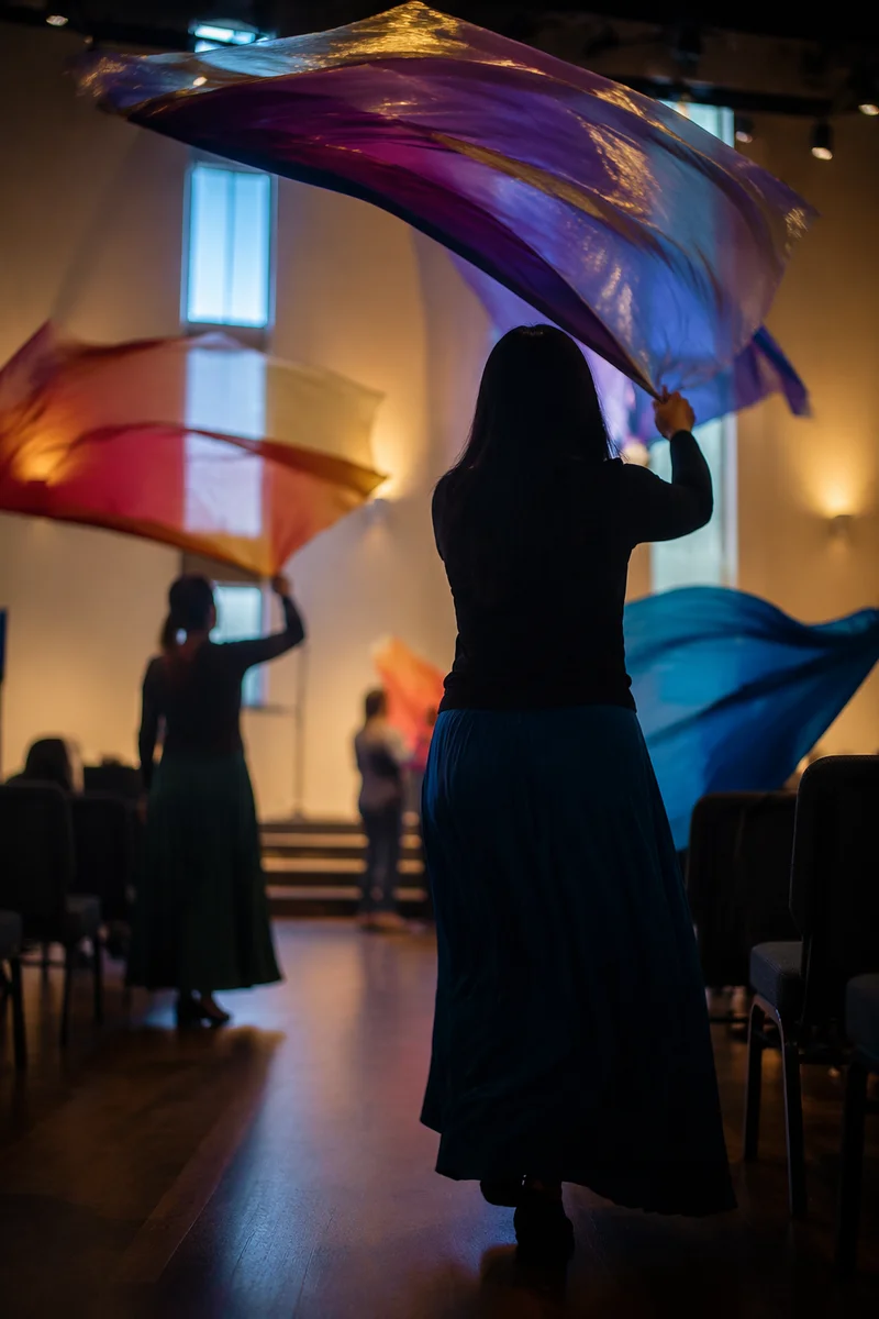 Colorful Worship Flags in Church Gathering