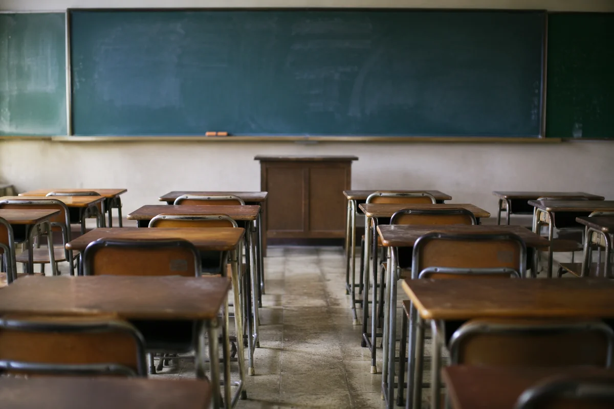 Quiet Empty Classroom with Chalkboard View