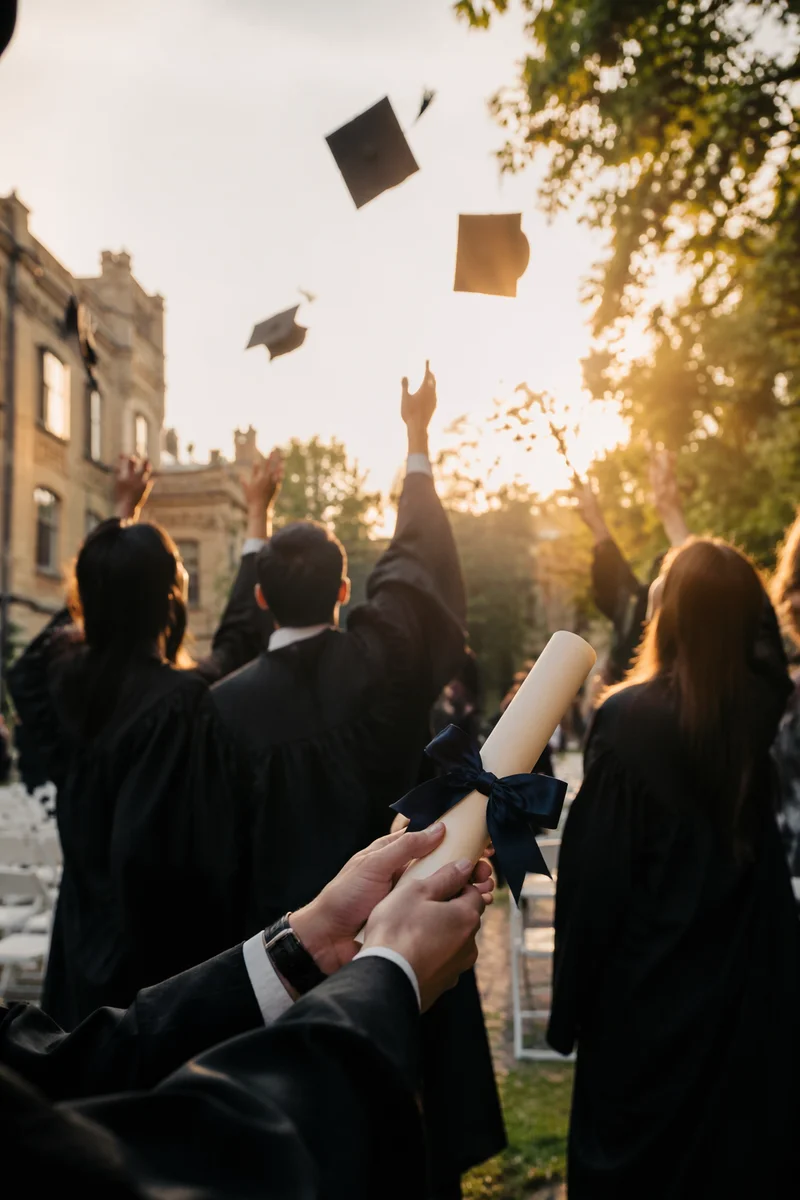 Graduation Caps and Diploma at Golden Hour