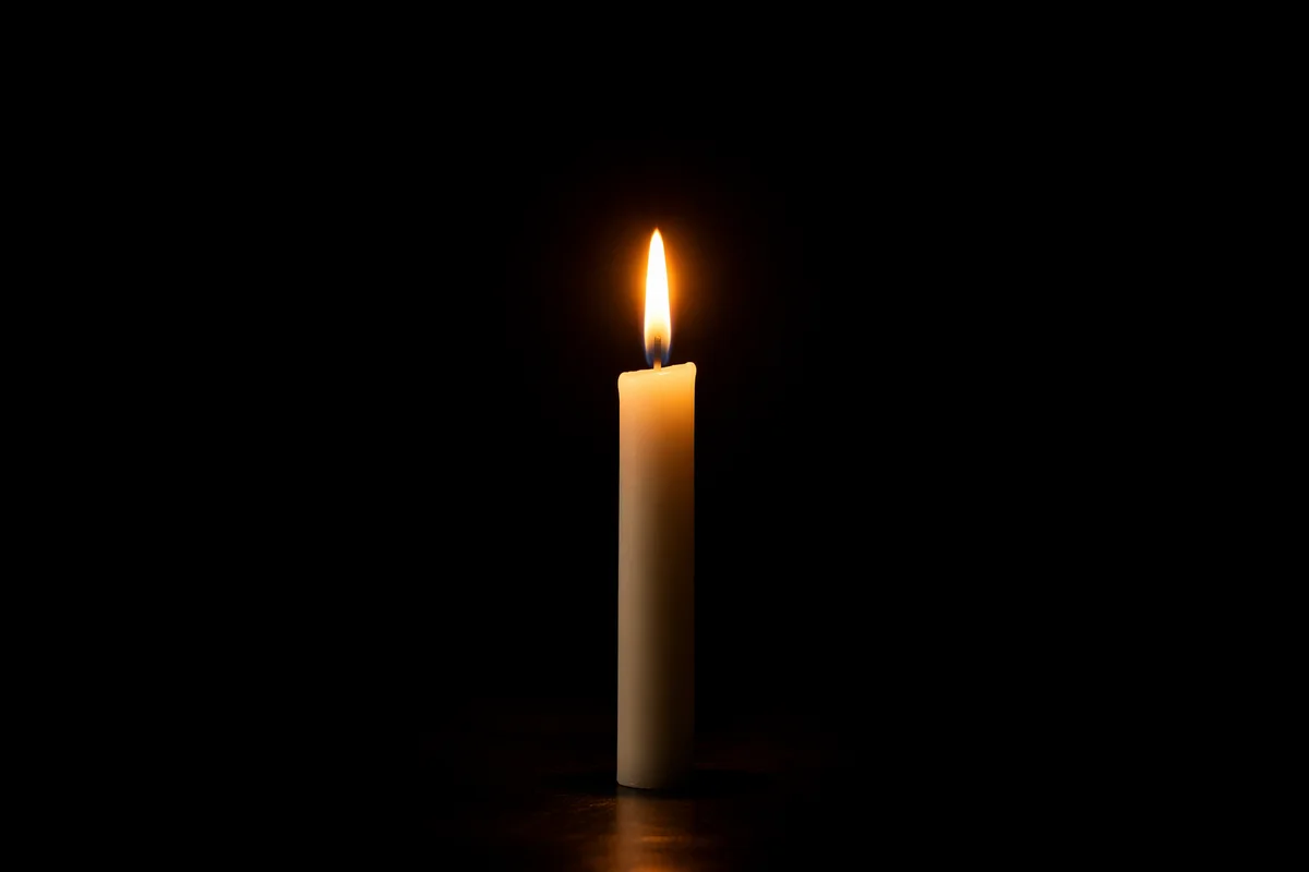 Courage Candle Burning in Vast Darkness