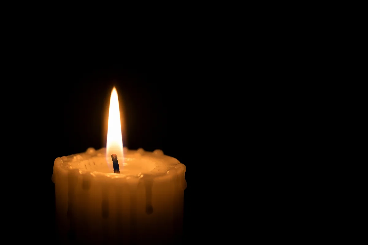 Single Candle of Courage in Darkness
