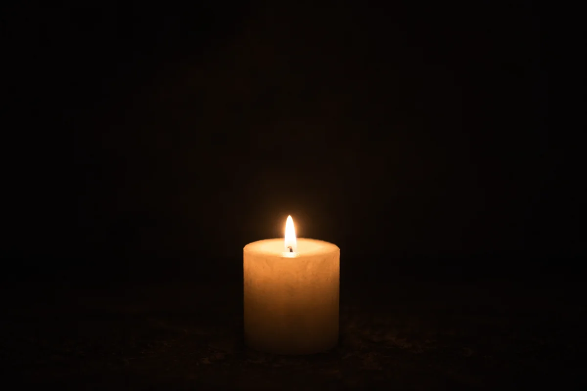 Single Candle of Courage in Darkness