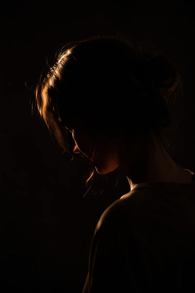 Humble Bowed Head in Gentle Golden Light