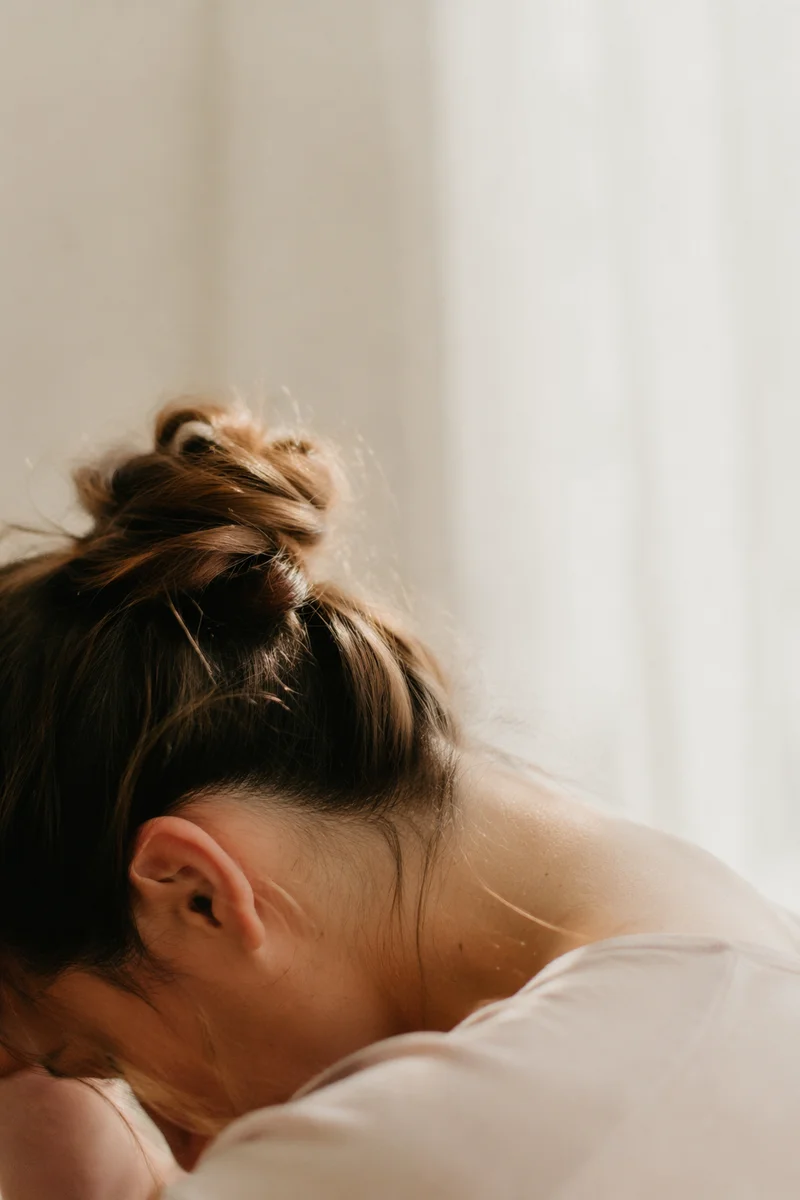 Humble Bowed Head in Gentle Window Light
