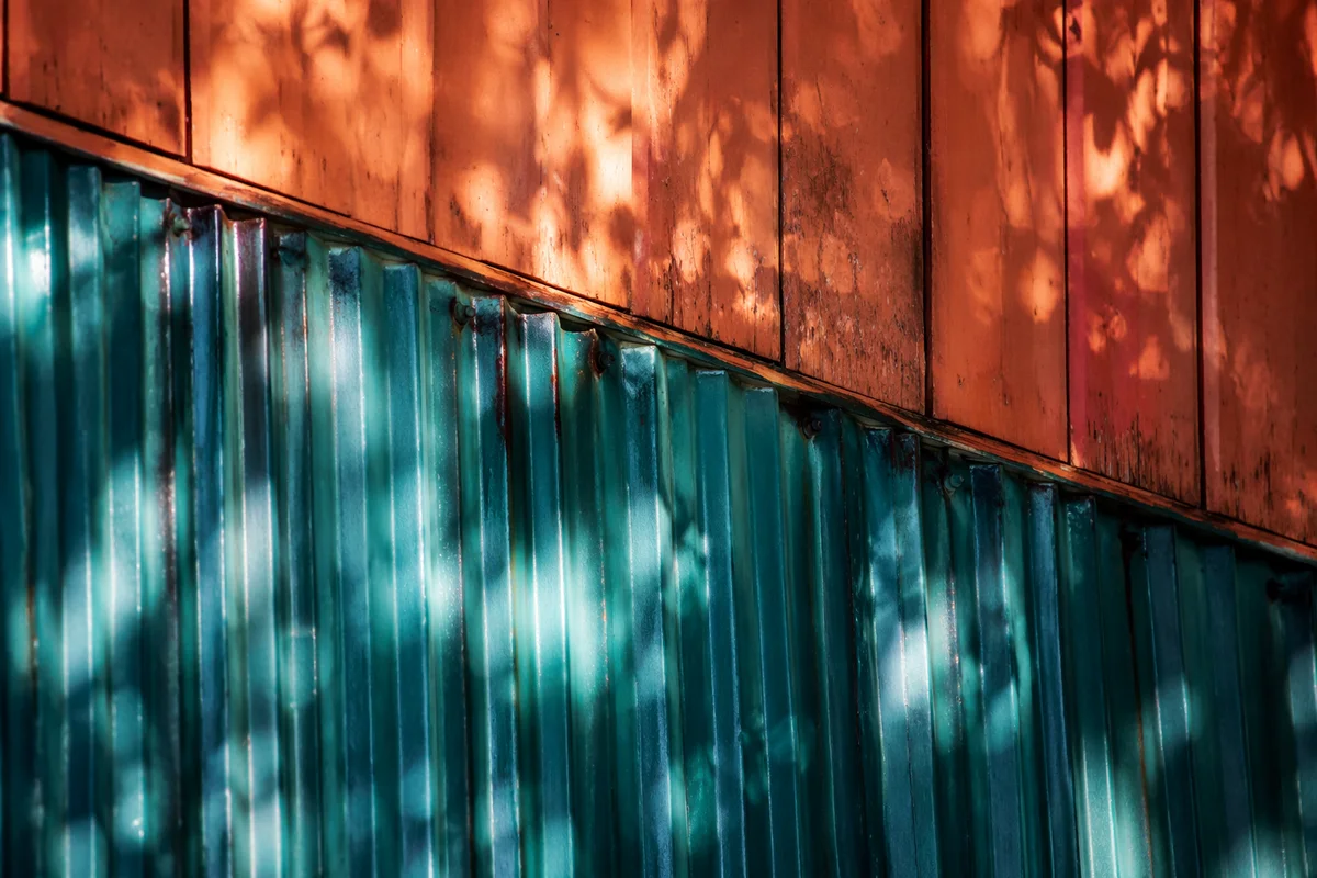 Joyful Sunlight on Teal Corrugated Metal
