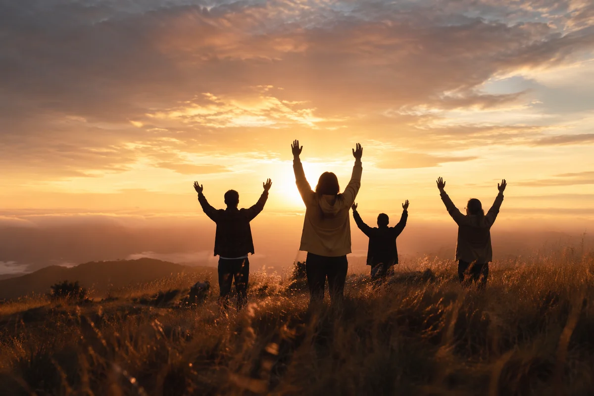 Silhouetted Praise Hands at Golden Sunset