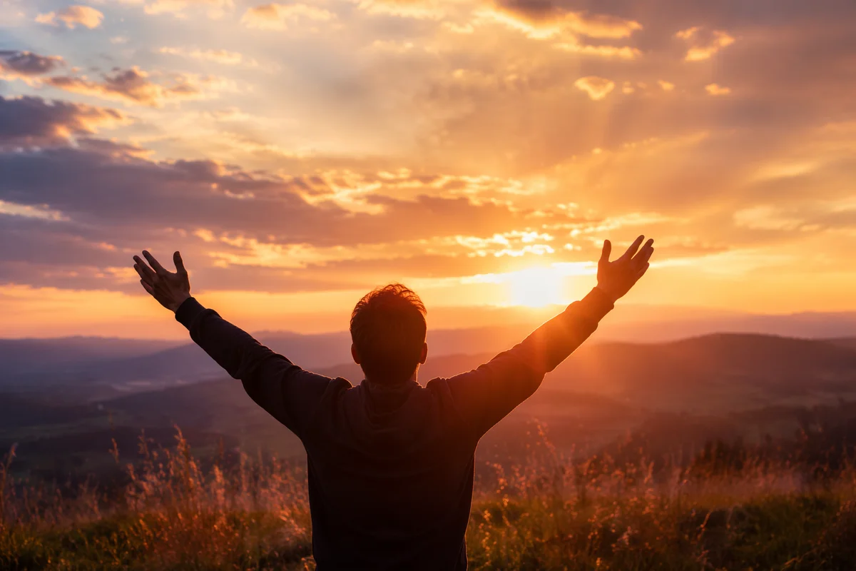 Praise Hands Raised at Golden Sunset