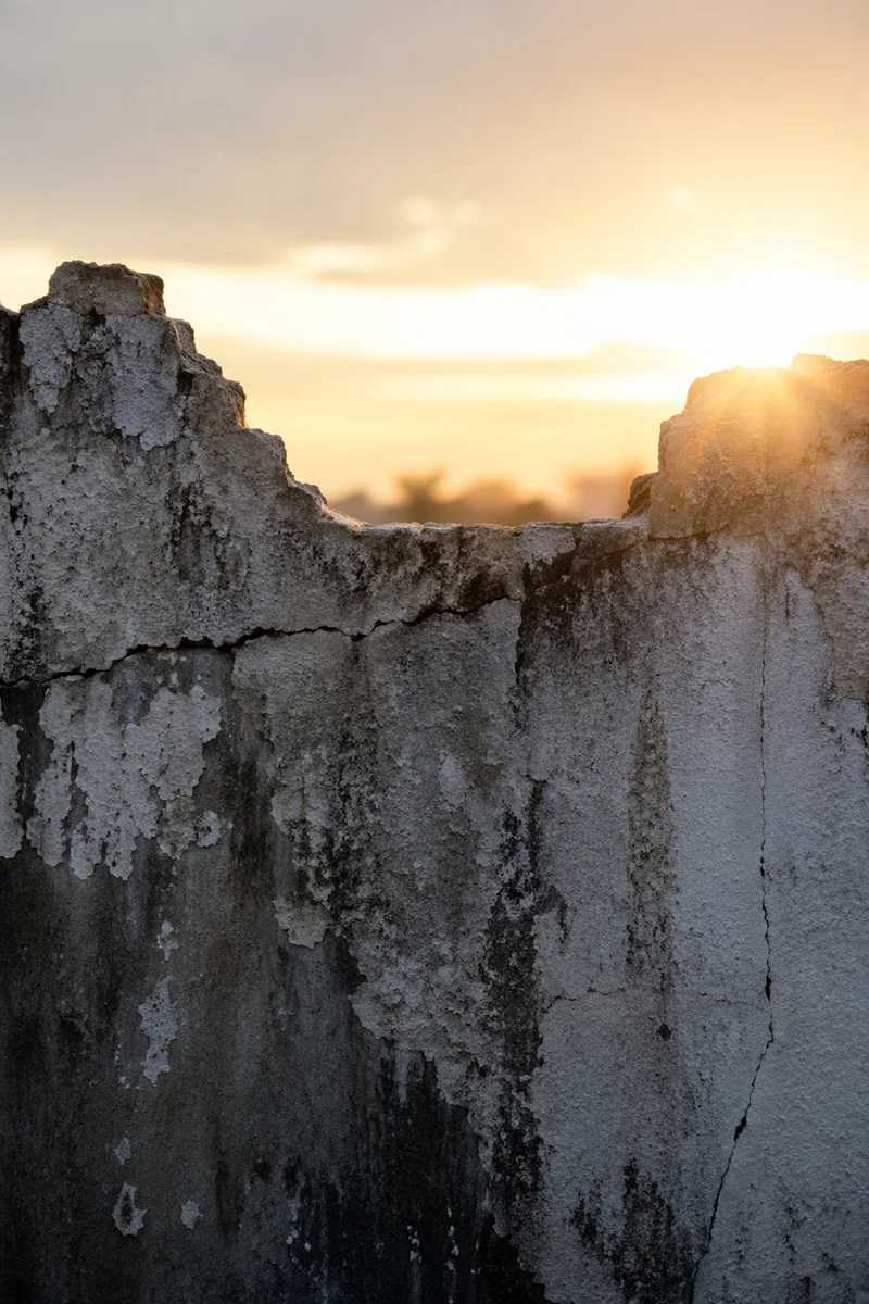 Redemption Sunrise Over a Broken Wall
