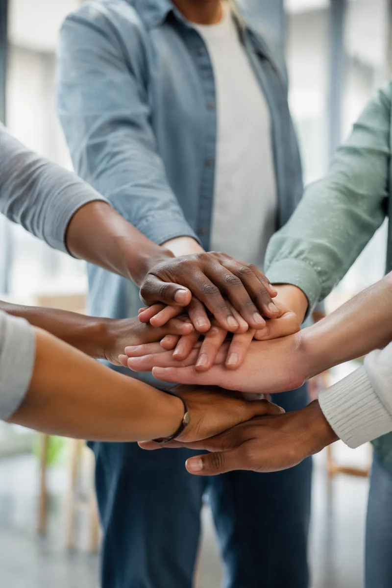 Diverse Hands United in Hopeful Support