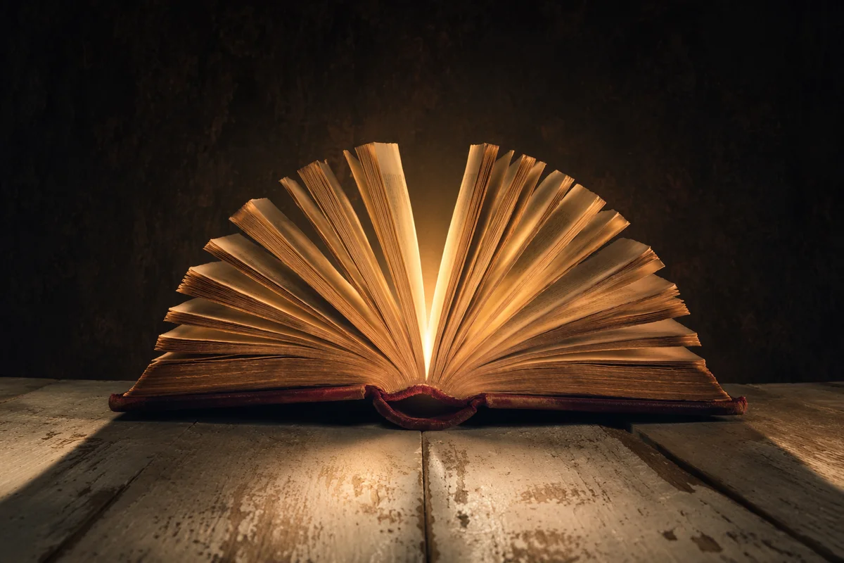 Wisdom Book Glowing With Golden Light