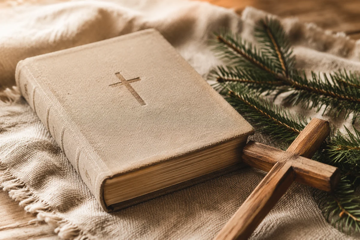 Bible and Wooden Cross on Linen