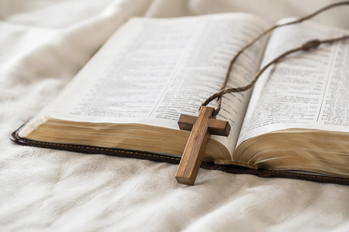 Wooden Cross on Open Scripture and Linen