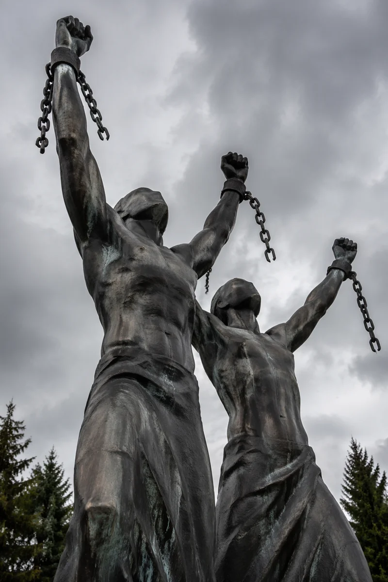Broken Chains Freedom Monument Under Stormy Sky
