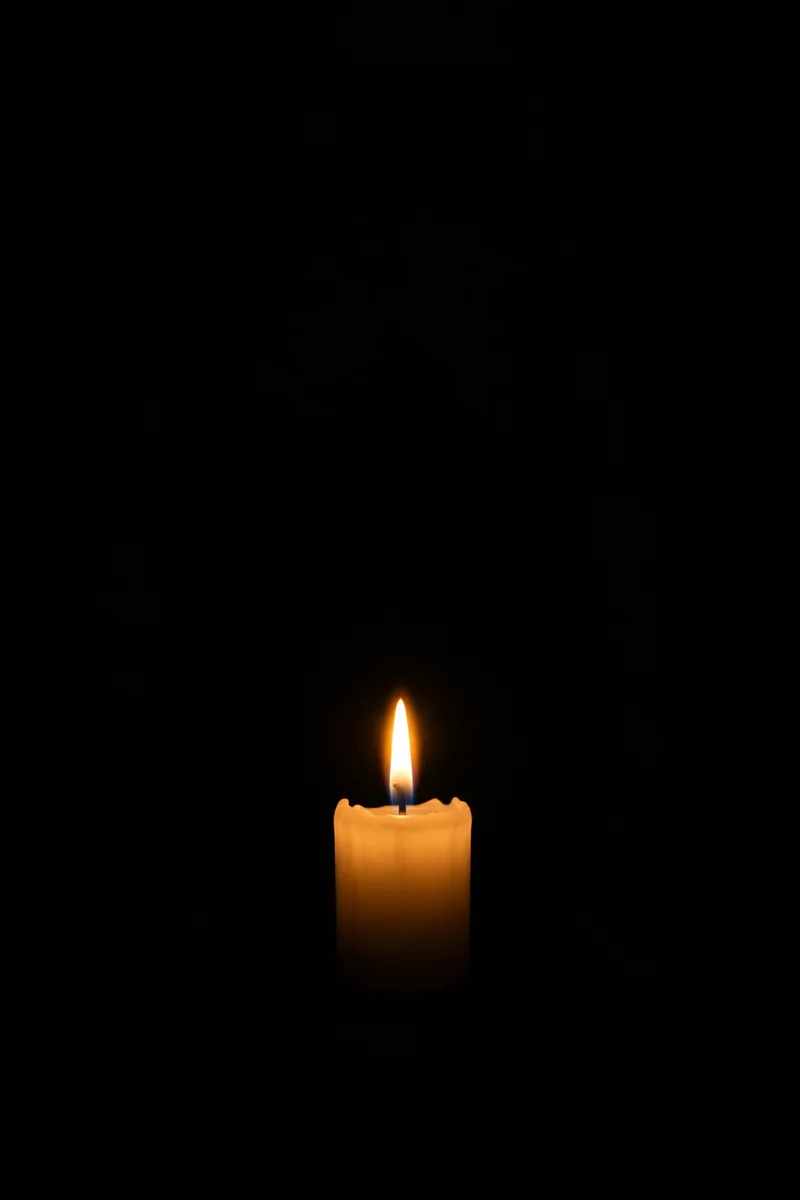 Burning Candle of Faith in Darkness
