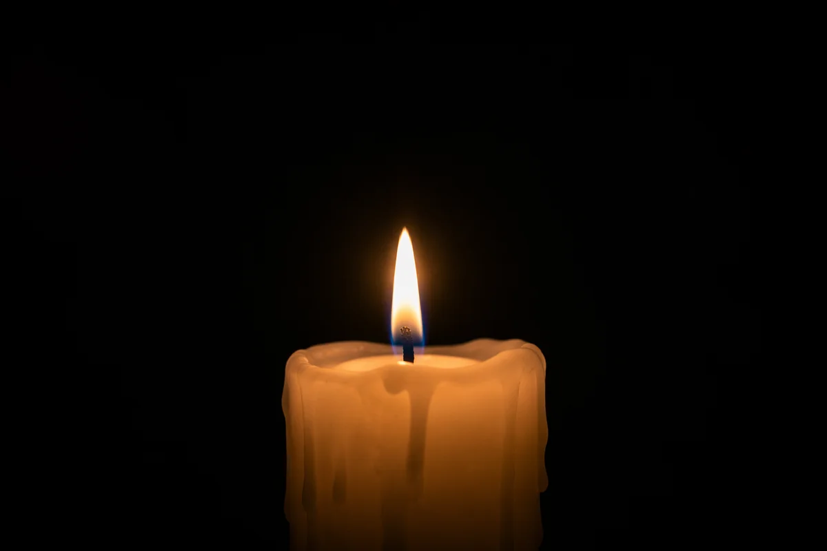 Burning Ivory Candle of Quiet Faith