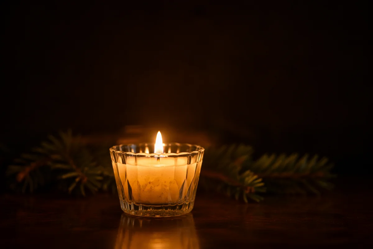 Burning Candle for Quiet Evergreen Faith