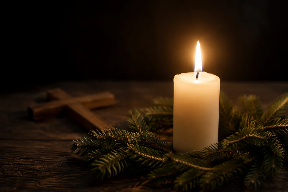 Burning Candle with Evergreen Faith Cross
