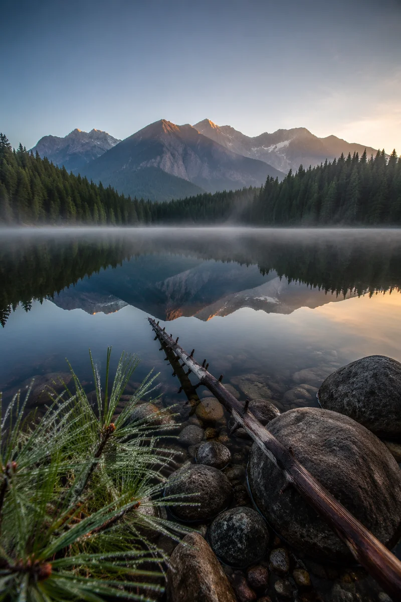 Calm Alpine Lake Reflection at Sunrise