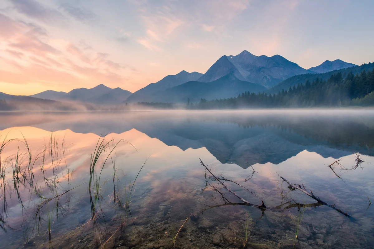 Calm Alpine Lake Reflection at Sunrise