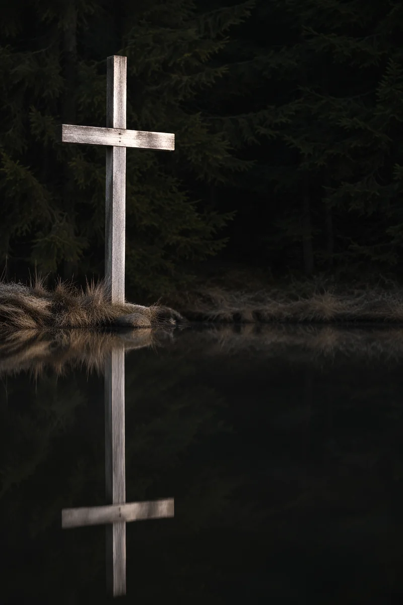 Wooden Cross Reflected in Still Pond