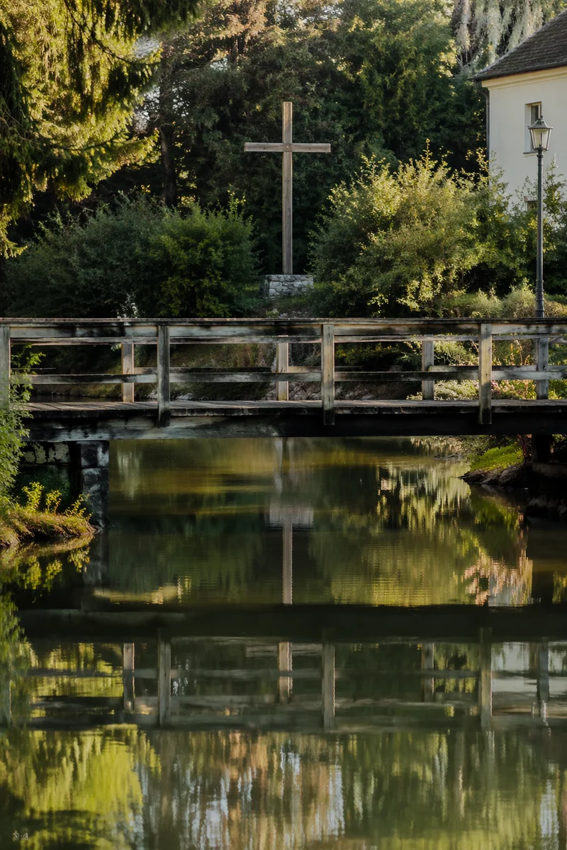 Wooden Cross Reflected in Evergreen River