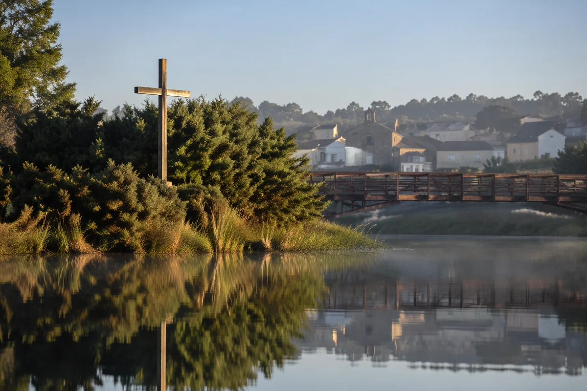 Wooden Cross Reflected in Quiet Riverside Water