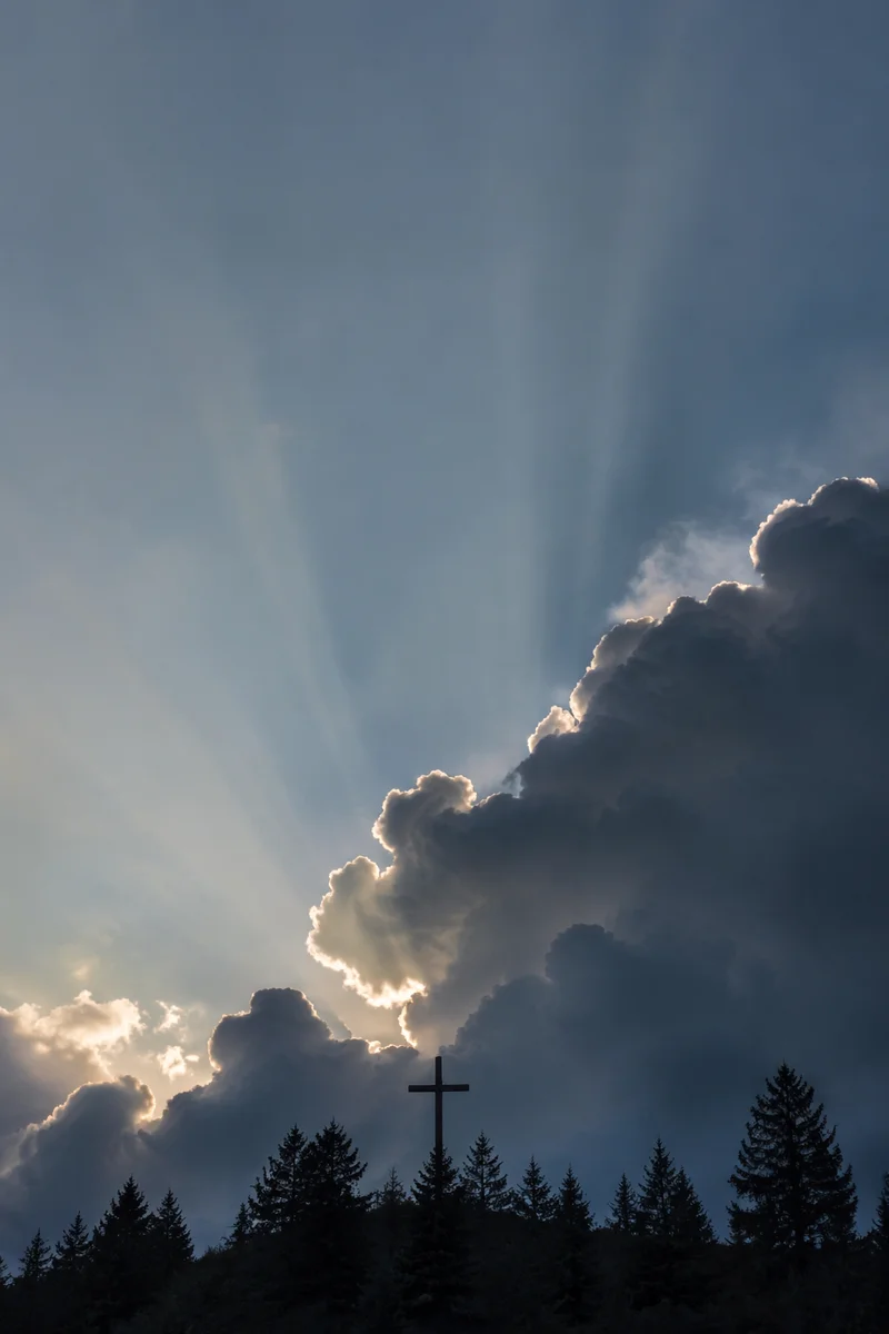 Wooden Cross Beneath Hopeful Storm Light