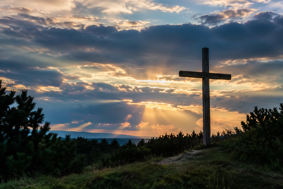 Wooden Cross with Sunset Light Rays