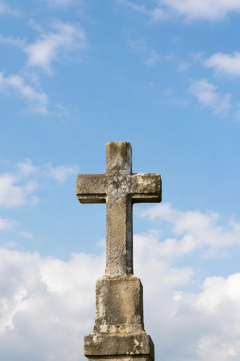 Empty Stone Cross Under Serene Blue Sky