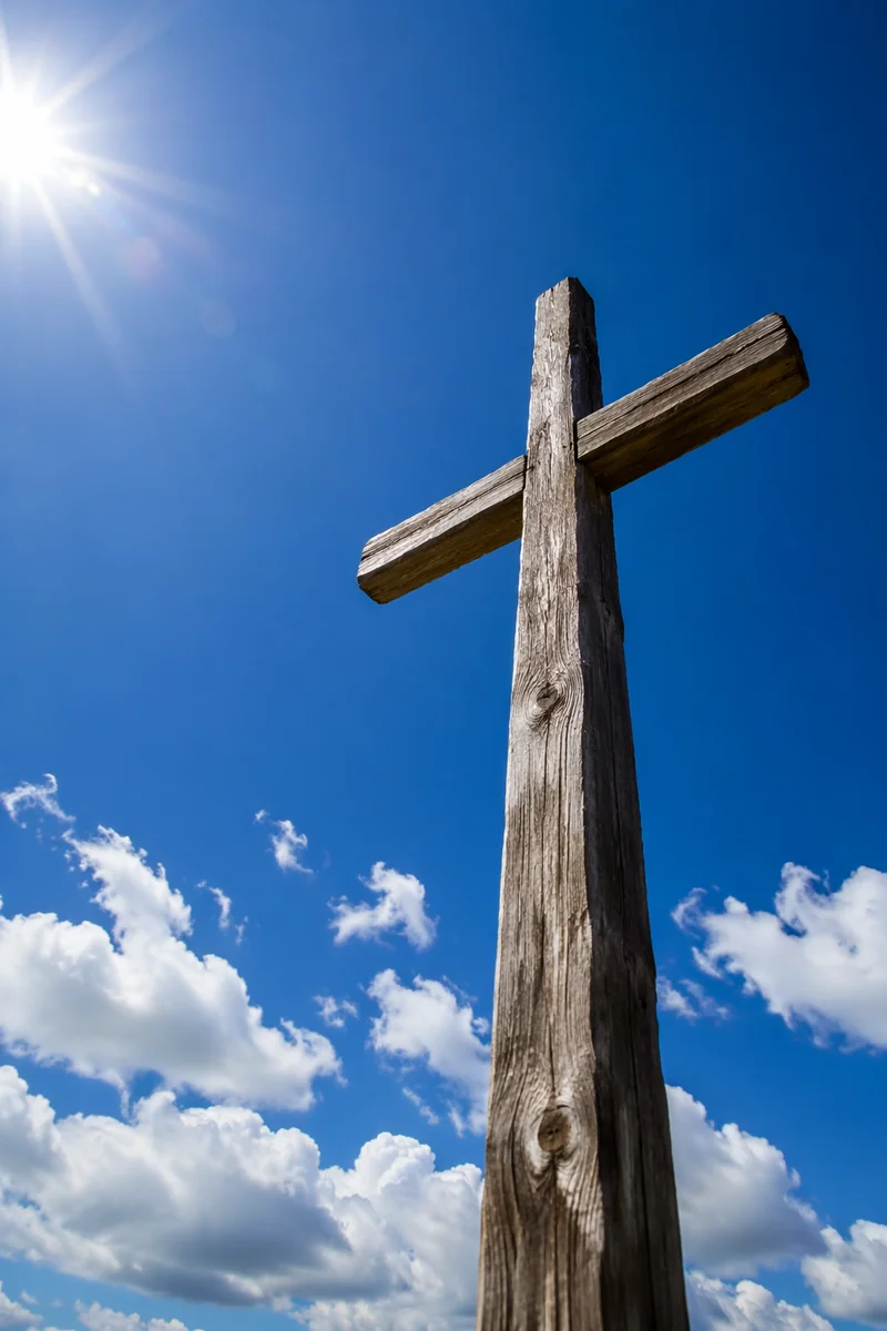 Empty Wooden Cross Beneath Blue Sky