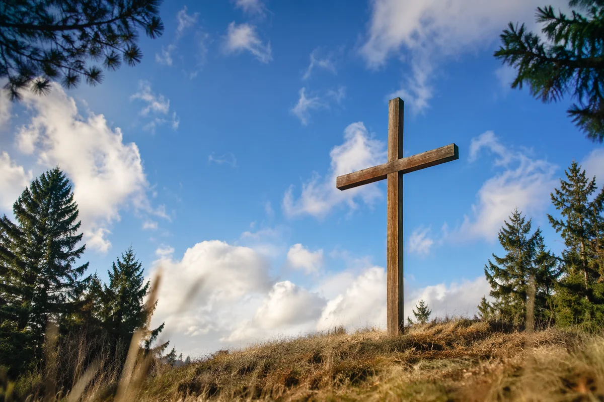Empty Wooden Cross Under Blue Sky