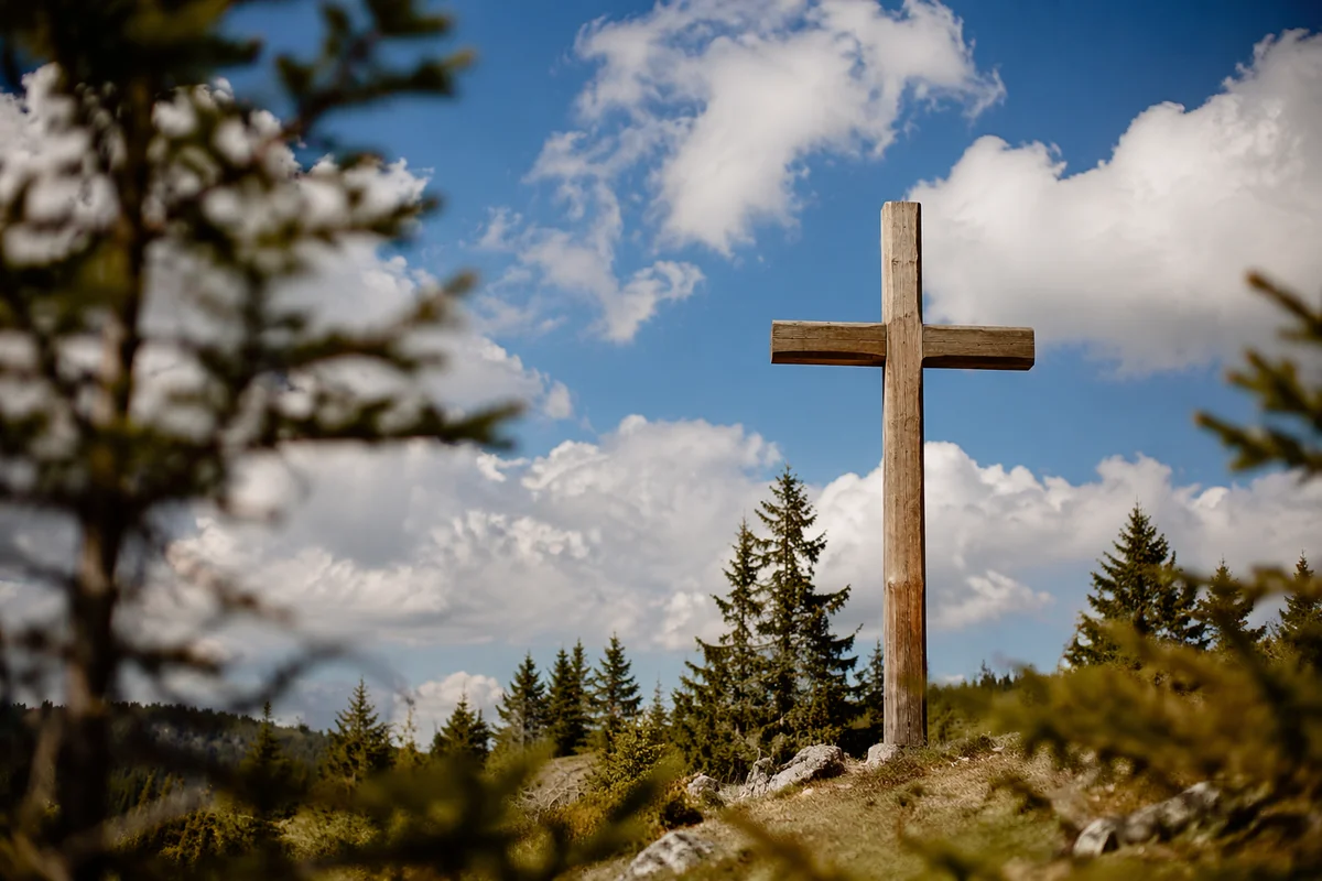 Empty Wooden Cross Beneath Blue Sky