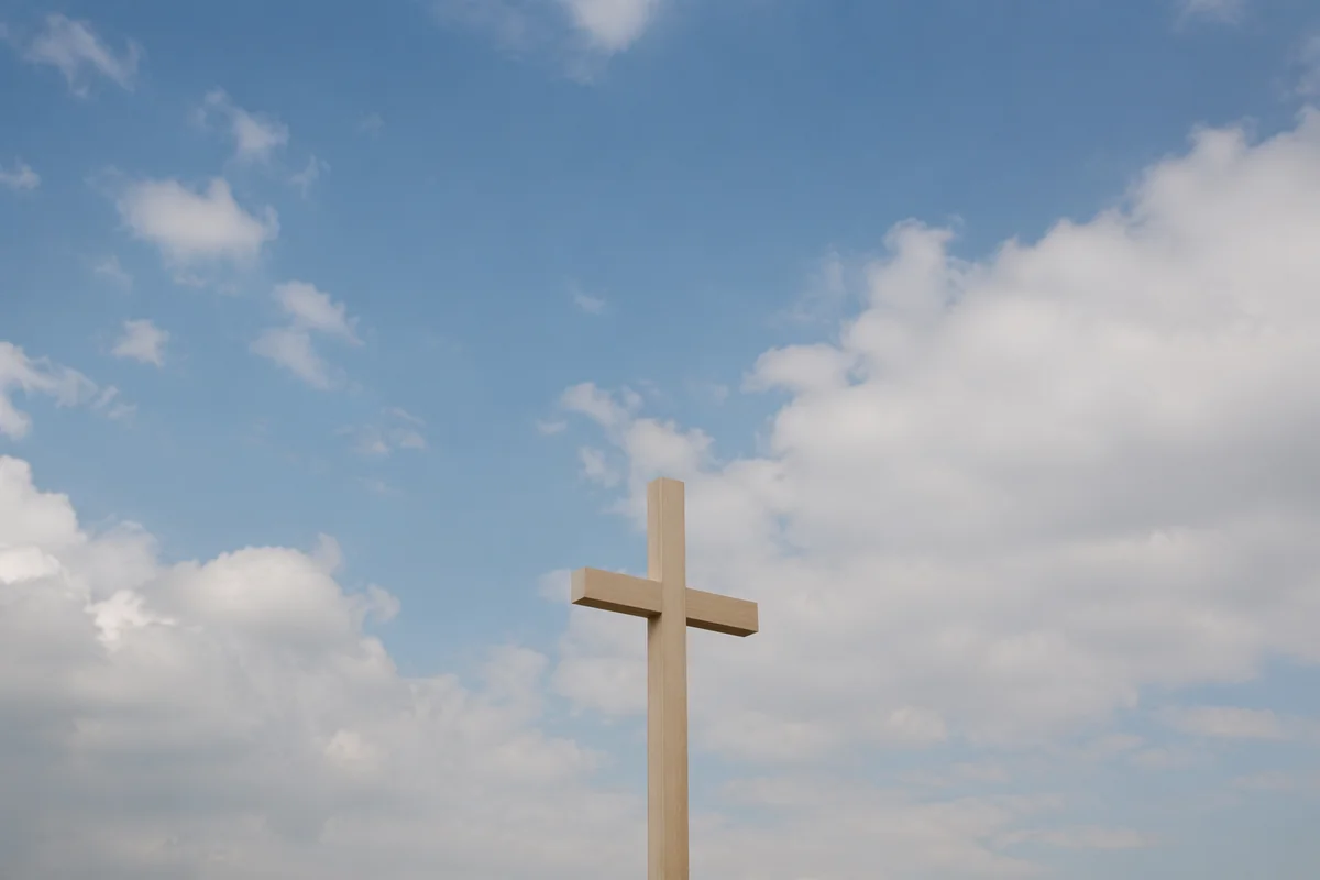Empty Wooden Cross Under Blue Sky