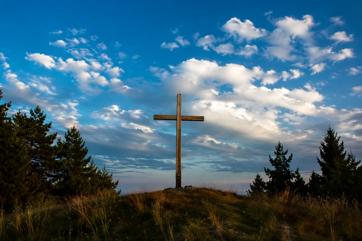 Empty Wooden Cross Under Blue Sky