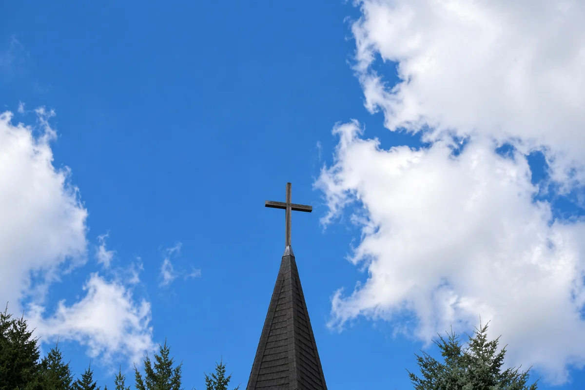 Empty Wooden Cross Beneath Blue Sky