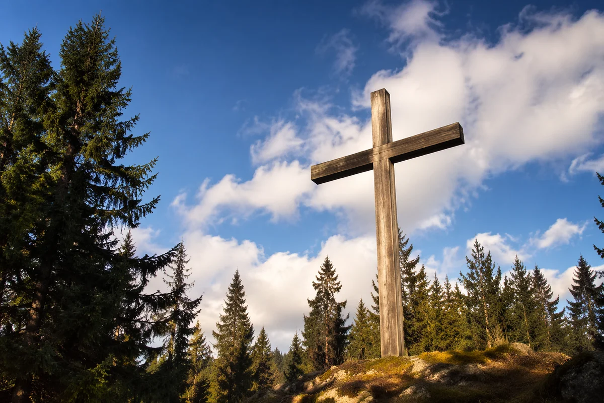 Empty Wooden Cross Under Blue Sky