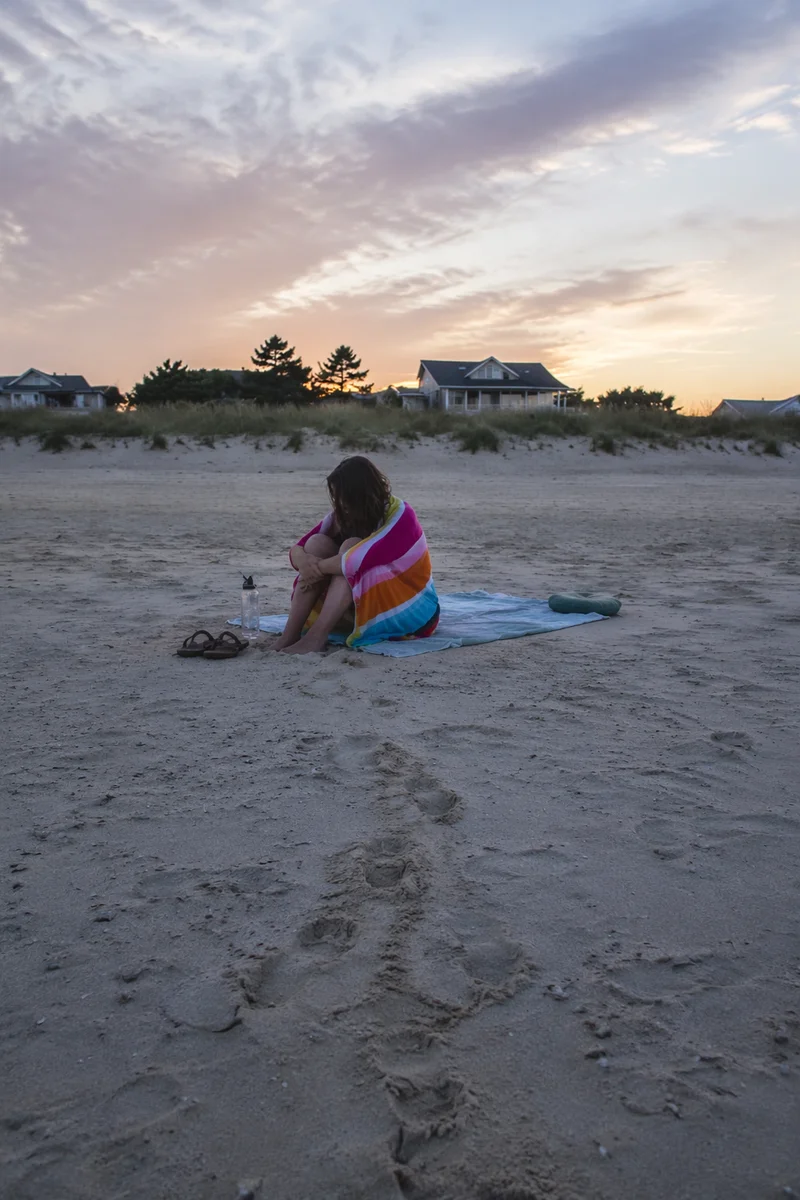 Footprints in Sand at Quiet Sunrise