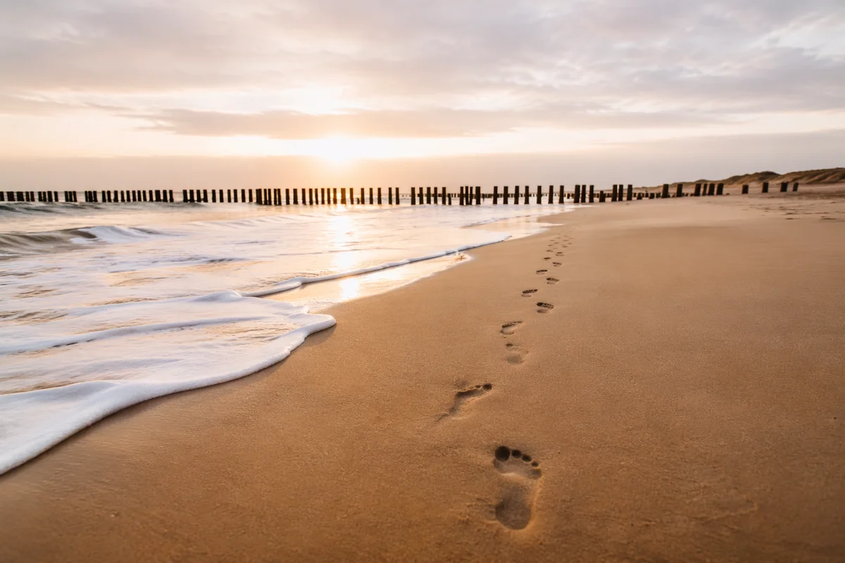 Sunrise Footprints on Quiet Sandy Beach