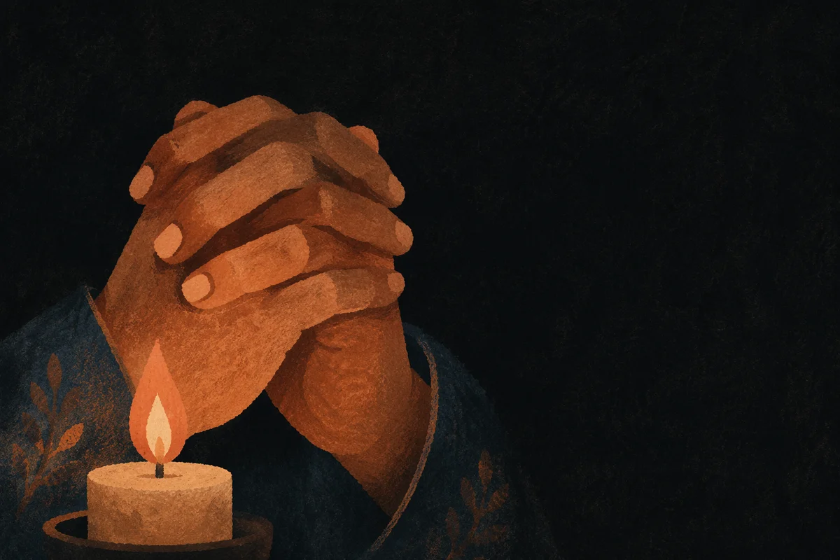 Hands Folded in Prayer by Candlelight