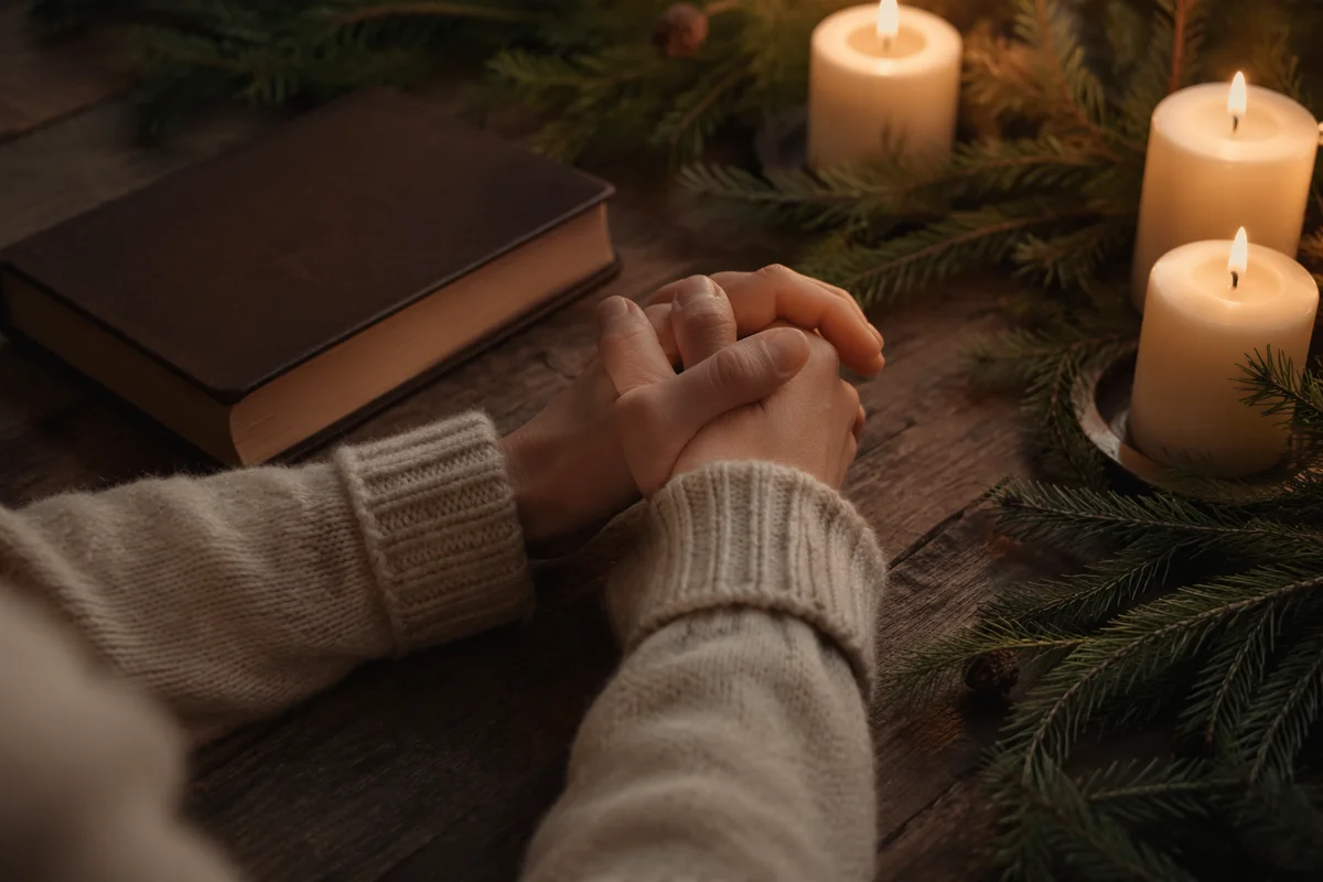 Candlelit Prayer Hands with Evergreen Sprigs