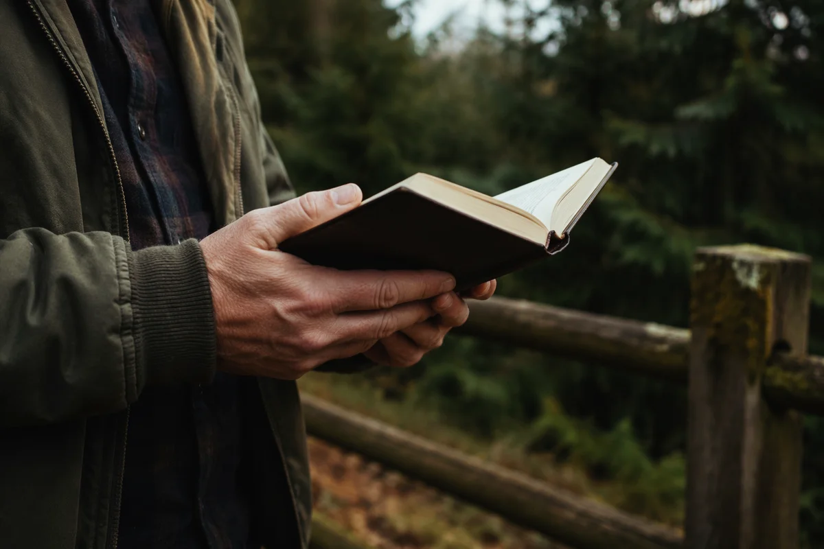 Hands Holding Bible in Evergreen Woodland