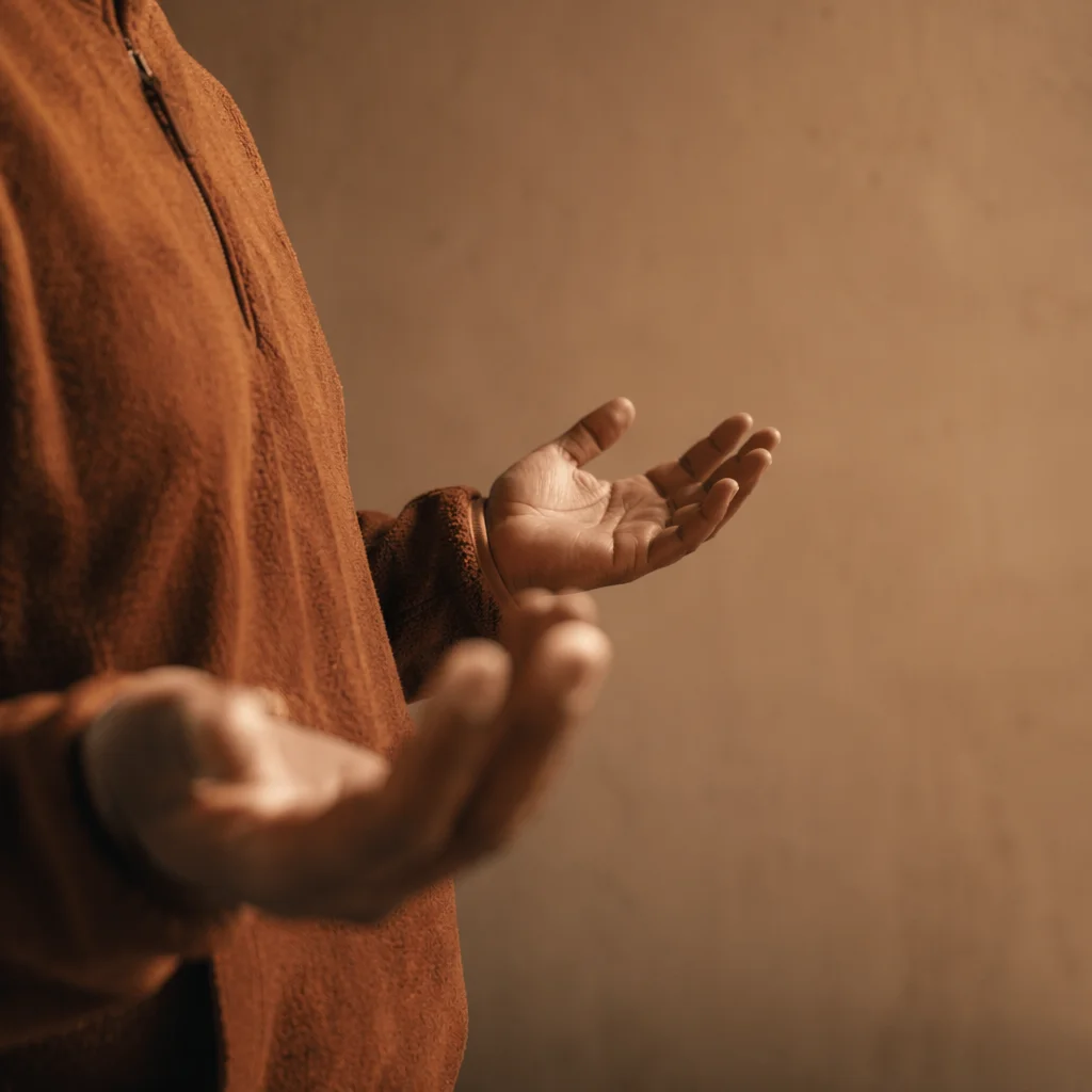 Open Hands in Warm Prayer Light