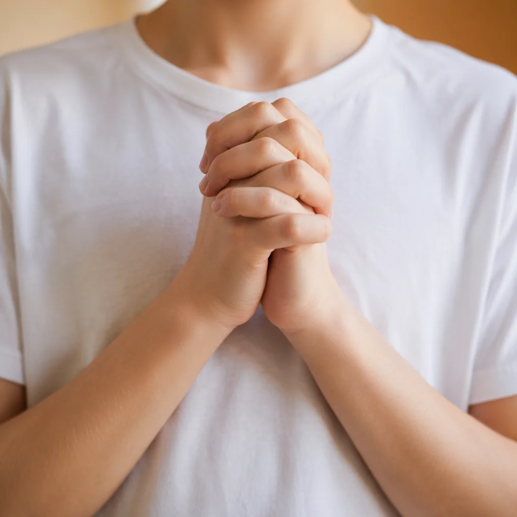 Clasped Hands Praying in Soft Daylight