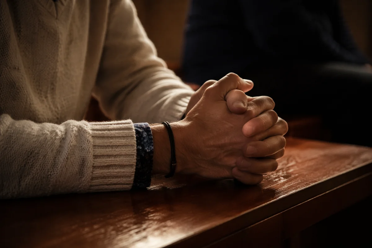 Clasped Hands in Soft Prayer Light