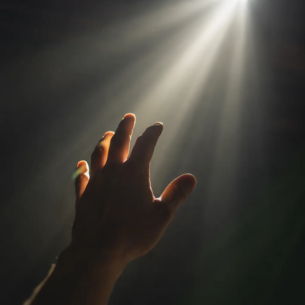 Hand Reaching Toward Hopeful Divine Light